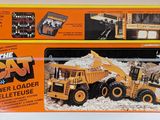 a box with a picture of a cat power loader and a remote control
