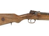 an old rifle with a wooden barrel on a white background