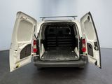 a white van with its doors open on the floor