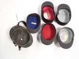 five hats that are sitting next to each other on a table