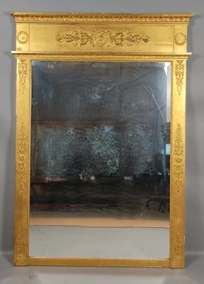 a mirror that is sitting on the wall in front of a fireplace
