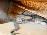a wicker basket and a pair of wrenches on the floor