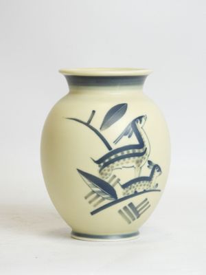 a white vase with a blue design on it