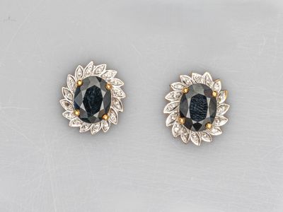 a pair of sapphire and diamond earrings