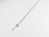 silver plated necklace with a long chain and a flower design