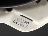 a black hat on top of a white skateboard