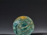 a glass ball that is sitting on a table