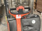 a forklift with a glass container on the back of it