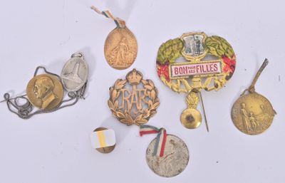 a lot of medals and medals on a white surface