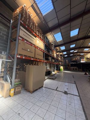 a large warehouse with a lot of boxes on the shelves