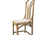 a wooden chair with a woven seat on a white background