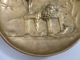 an image of a gold medal with a lion on it