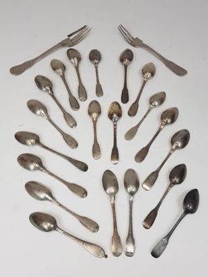 a lot of spoons and forks arranged in a circle