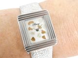 a woman ' s wrist that has a watch on it