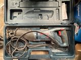 a tool in the case that is sitting on the floor