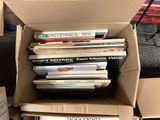 a box full of books sitting on the floor