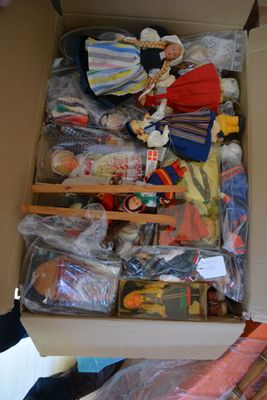 a cardboard box filled with toys and other items