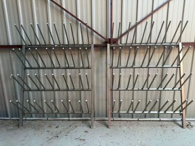 a metal gate with a bunch of sticks sticking out of it