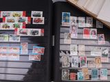 a open book with stamps on it sitting on a table