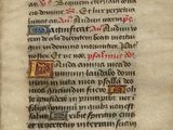 Un vieux livre sur lequel sont inscrits des mots est posé sur une table