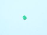 a green object in the sky that is flying in the air