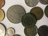 a lot of coins that are on the table