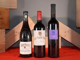 three bottles of wine sitting next to each other on a table