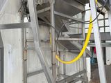 a metal staircase going up to the top of a building