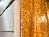 a close up of a wooden cabinet with a clock on it