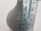 a measuring tape on the side of a glass vase