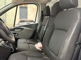 the interior of a car with black leather seats and a flower in the passenger seat
