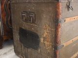 two old trunks sitting next to each other on the floor