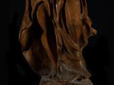 an old statue of a woman holding a baby in her arms