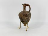 an image of a vase on a stand on a white background
