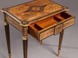 an antique writing desk with a drawer on one side and a drawer on the other side