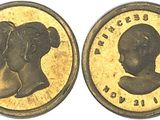 two pieces of gold coin with a woman ' s profile and a man ' s profile