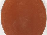 a brown plate on a white surface with a white background