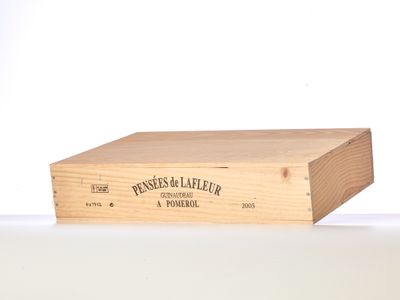 a wooden box with a label on it sitting on a table