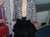 a mannequin with a black skirt and a leopard print shirt