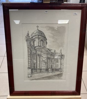 a drawing of a church in a frame on display in a store