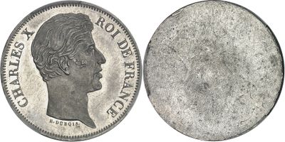 gros plan d'une pièce de monnaie sur laquelle figure un visage de femme