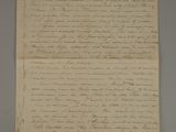 a piece of paper with writing on it sitting on top of a table