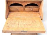 a small wooden desk with a mirror on top of it