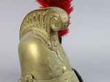 helmet of a roman soldier with a red plume on top of it