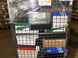 a metal cart with many boxes on it in a warehouse