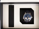 a watch in a box with a strap around it