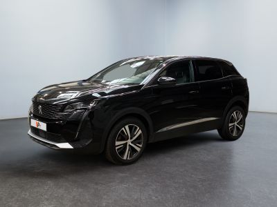 the black suv is parked in a room with a white wall