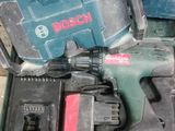 a pile of tools that are on a wooden table
