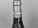 a bottle of wine that is sitting on a table