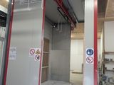 an image of a large room with a red door